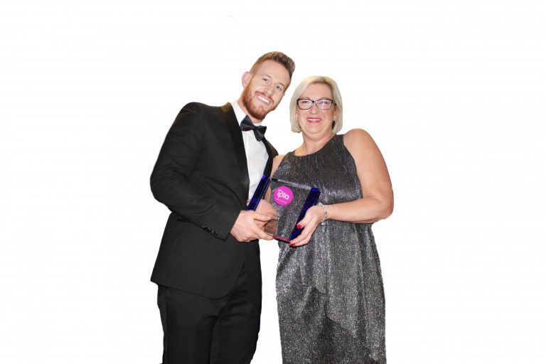 Mike Bennett from Antalis presents Kath Doran from Spectrum Plastics with their award.