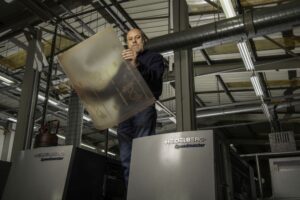 Graham Faulkner Works Manager holding Flenex plates at CPI Books