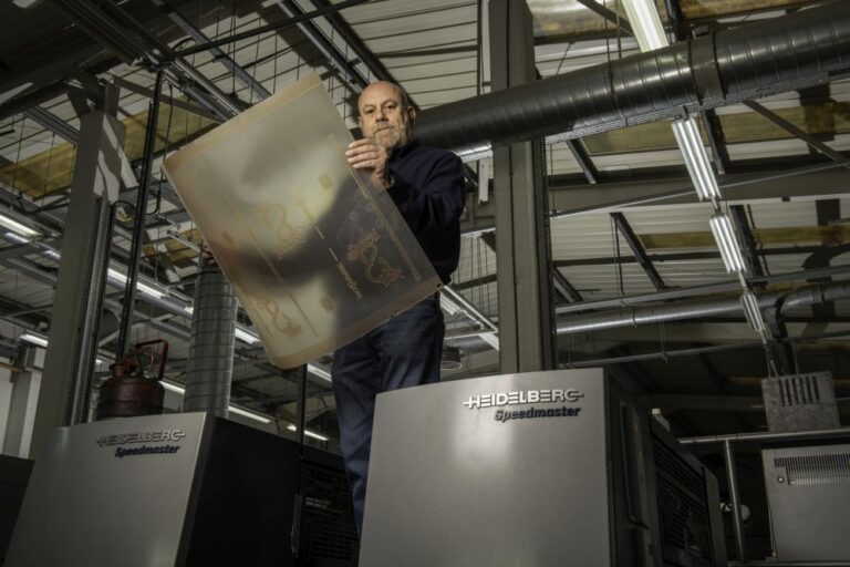 Graham Faulkner Works Manager holding Flenex plates at CPI Books