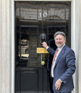 Charles Rogers Knocking at Number 10 Downing Street IPIA Chair