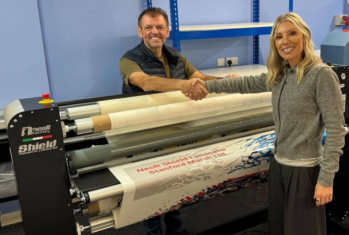 john brailsford and amy smith of stanford marsh at john brailsford printers chaking hands